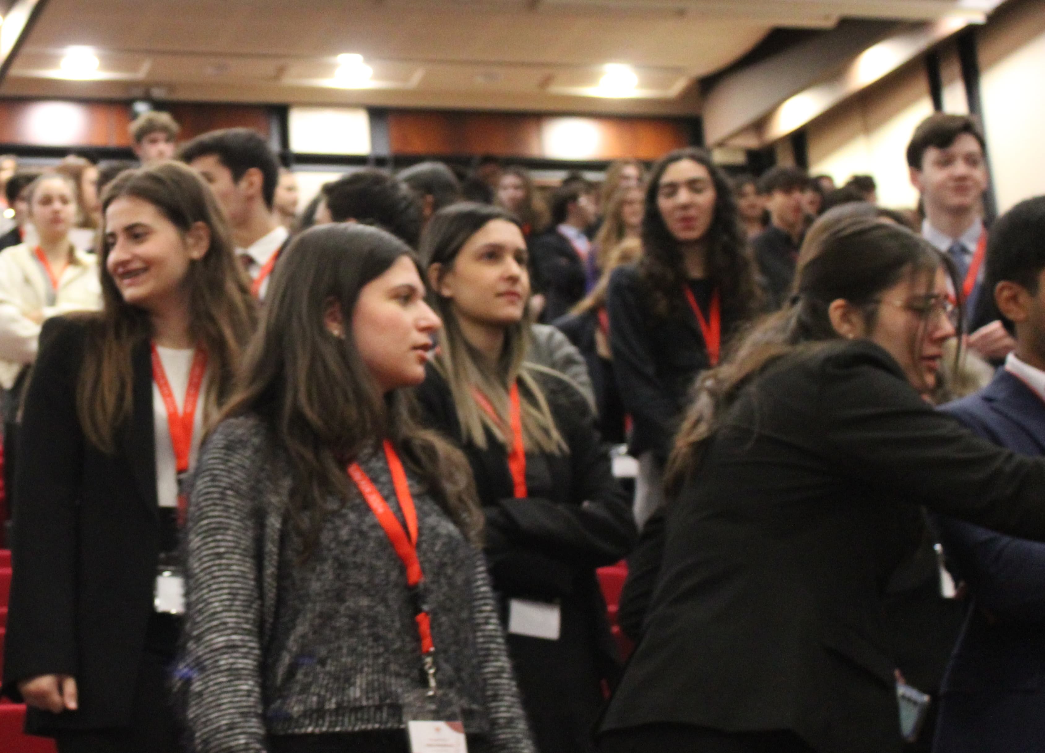 Delegates standing at the end of the plenary